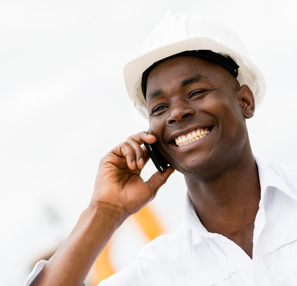 Architect talking on the phone at a construction site